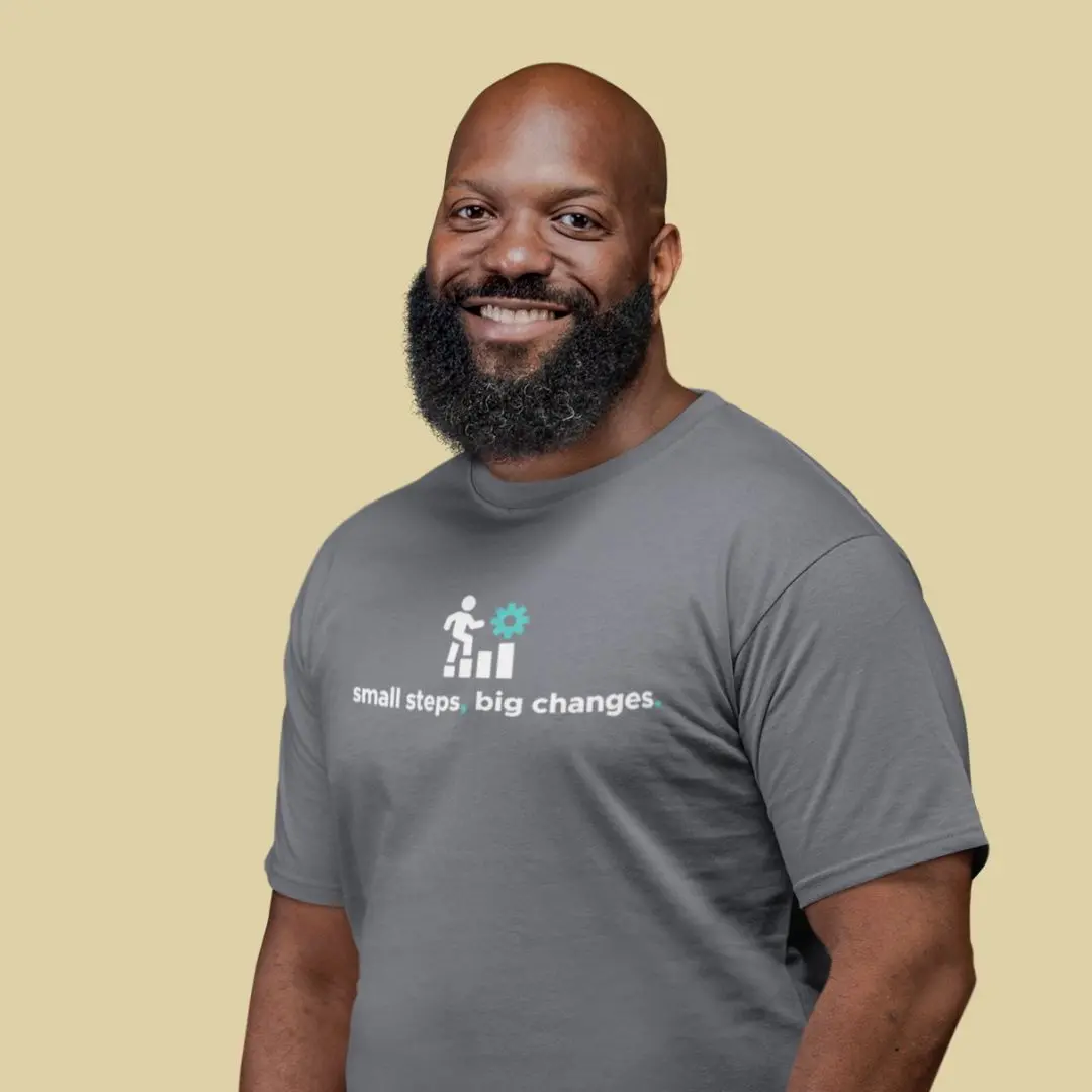 Man in grey shirt smiling