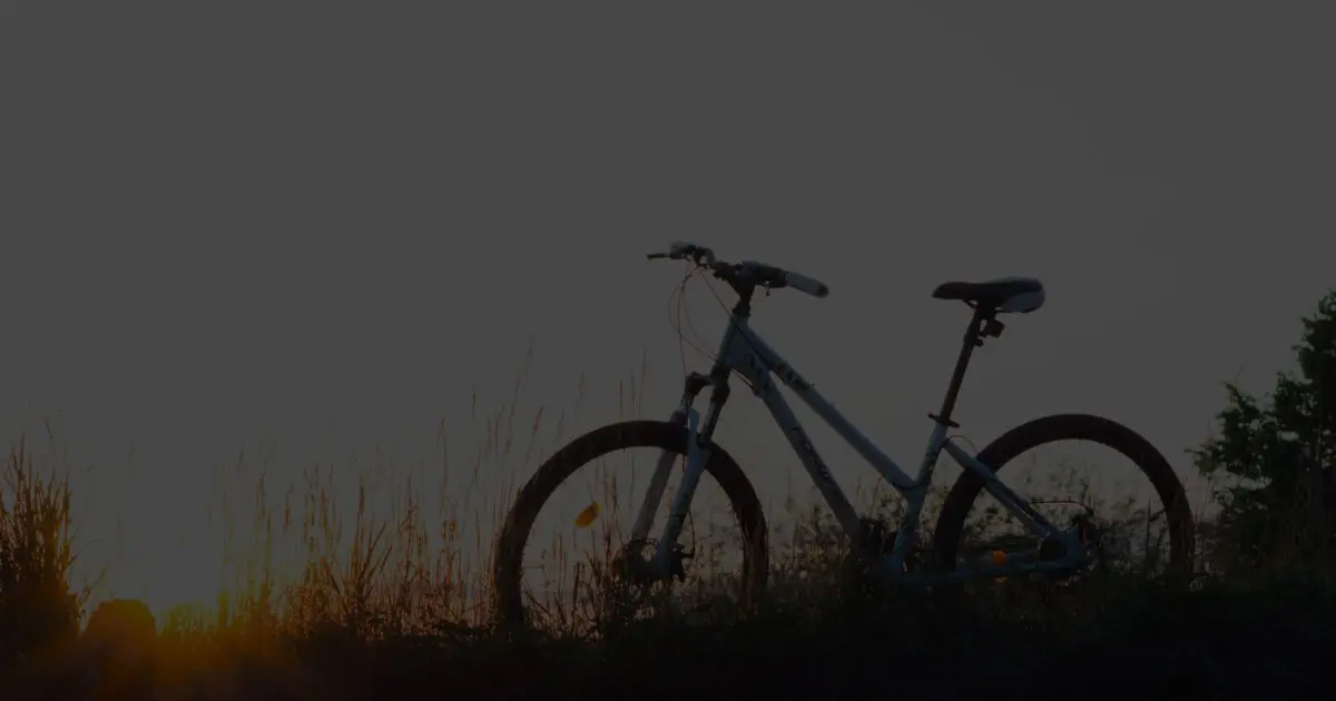 Silhouette of a bicycle at sunset symbolising the Free Bikes 4 Kids project, helping children access bikes for free.