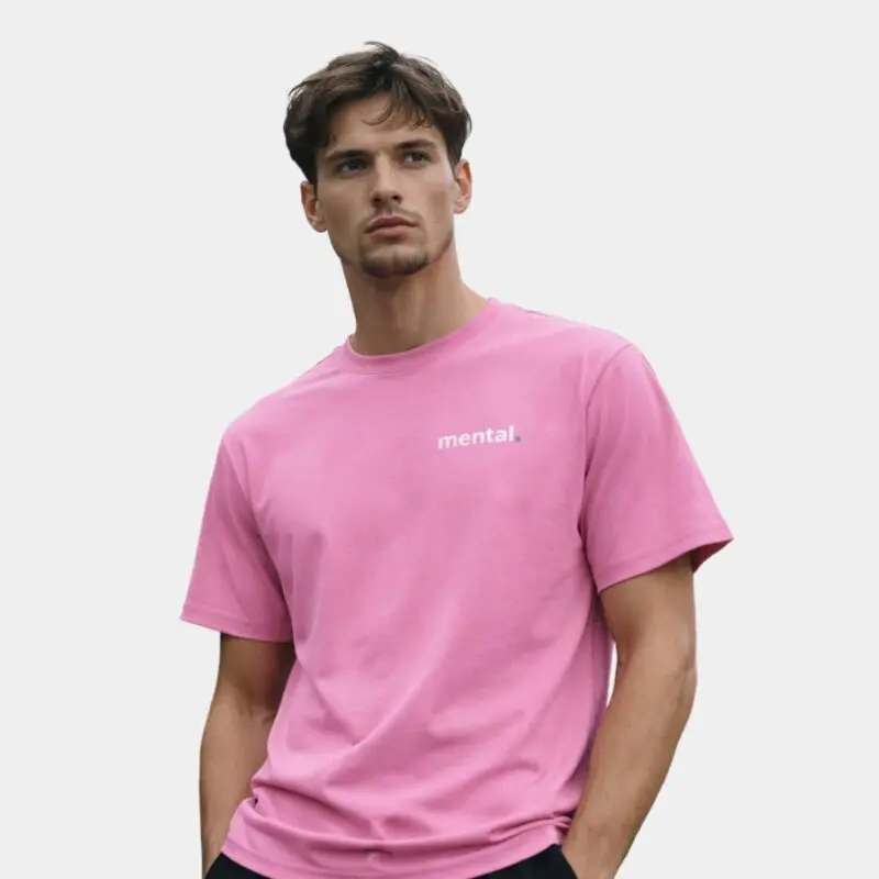 Man wearing pink Mental T-shirt.