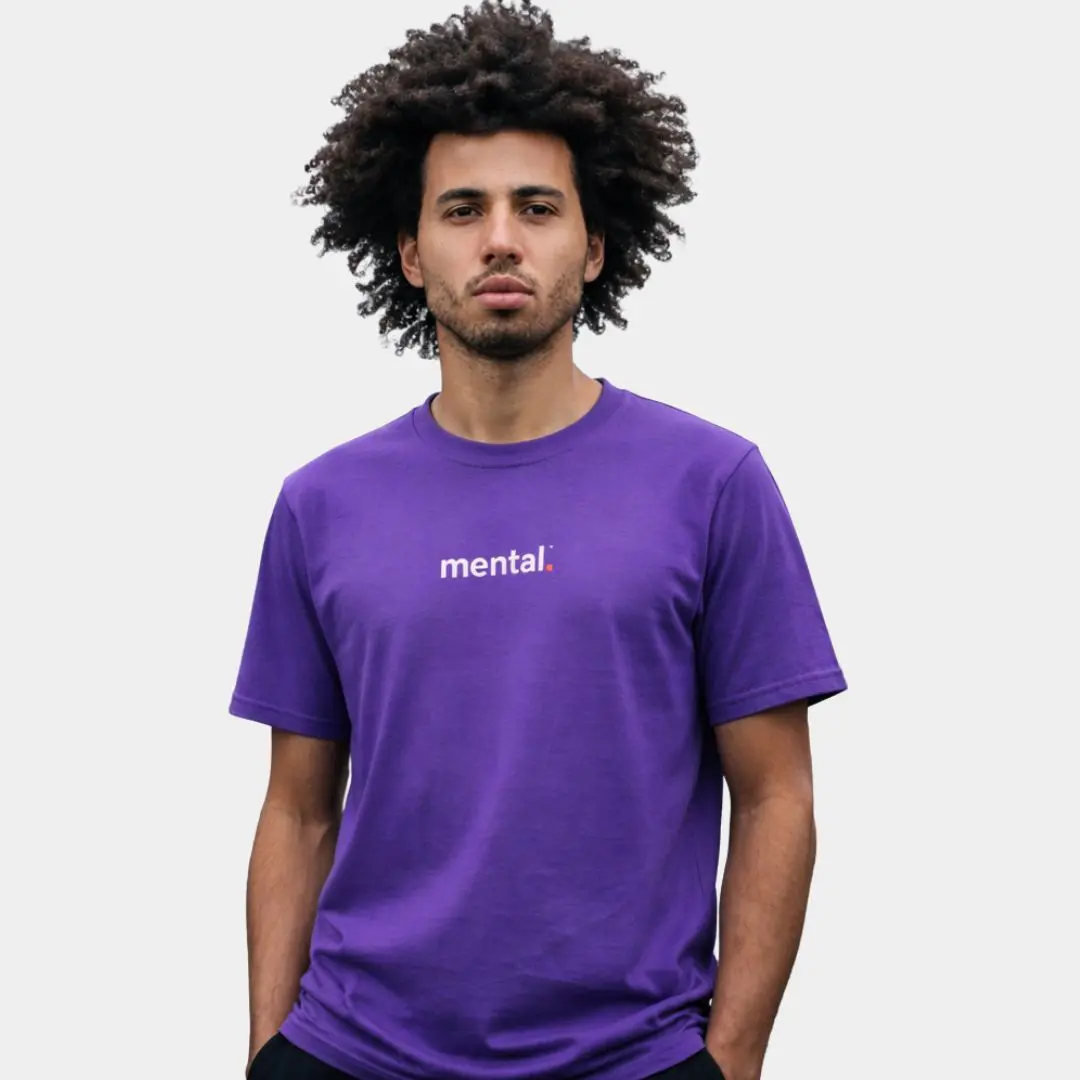 Man wearing purple 'mental.' t-shirt.