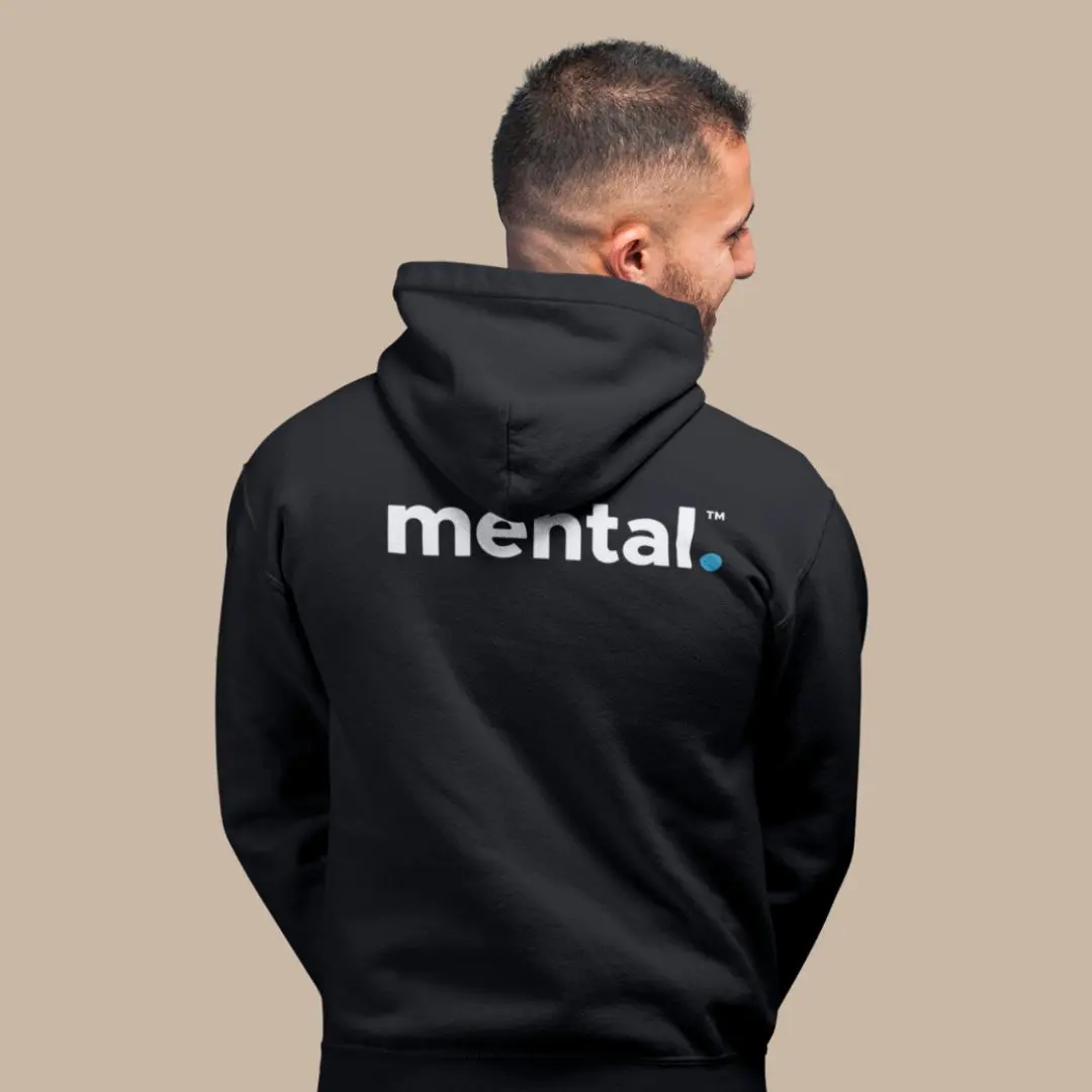 Man wearing black hoodie with 'mental' text.