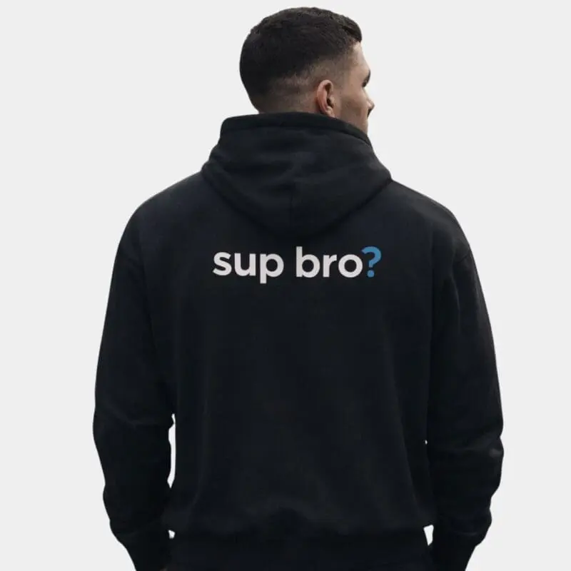 Man wearing black hoodie with ‘sup bro?’ text